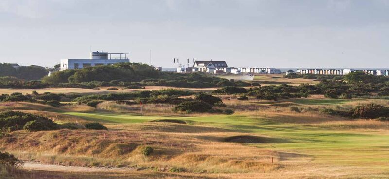 13th green with clubhouse in distance